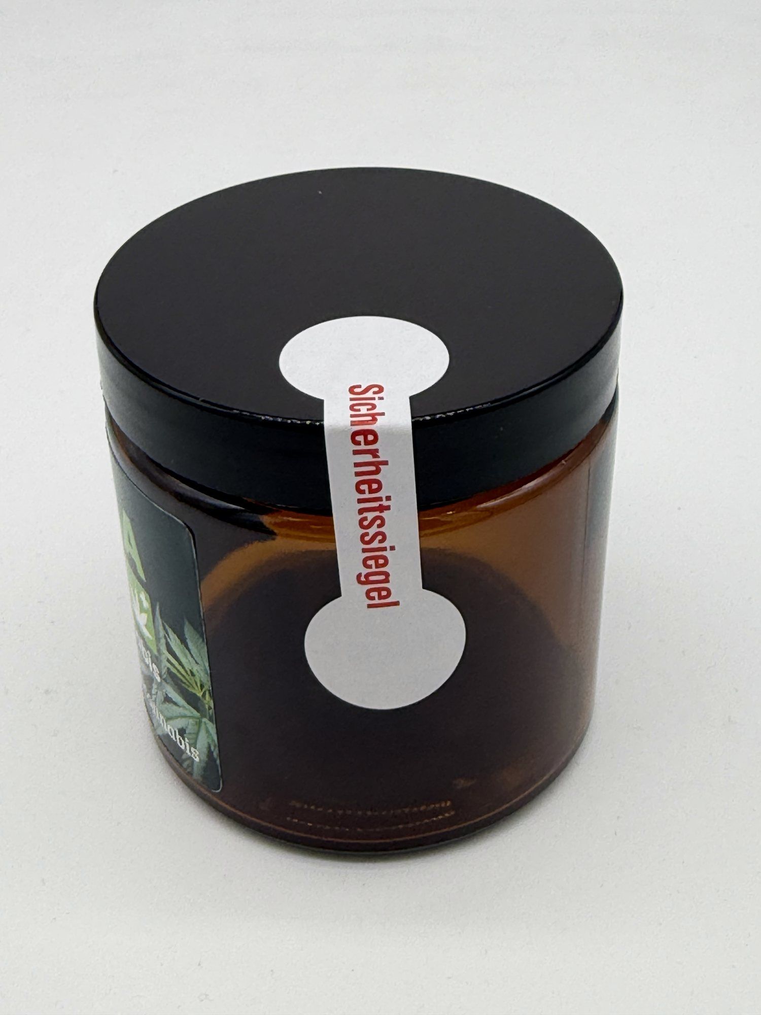 CannaRoKo-Glas mit weißem Sicherheitssiegel, das über Deckel und Glas geklebt ist